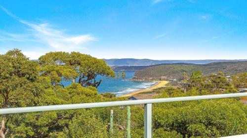a view of the ocean from a balcony at 'Headlands at Killcare' by HolidayCo in Killcare