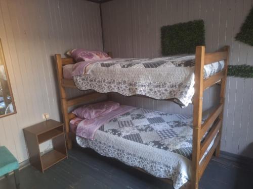 Una cama o camas en una habitación de Hostel INK - Duerme Como En Casa