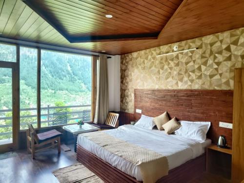 Ένα ή περισσότερα κρεβάτια σε δωμάτιο στο Aanagha Stay & cafe