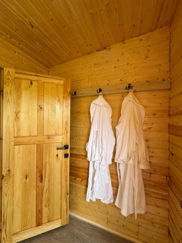 a sauna with wooden walls and a door at Bosogo Yurt camp in Bokonbayevo