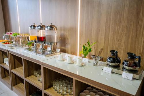 a counter with many differentiatesiatesiatesiatesiatesiatesktop at Astica Hotel Nha trang in Nha Trang