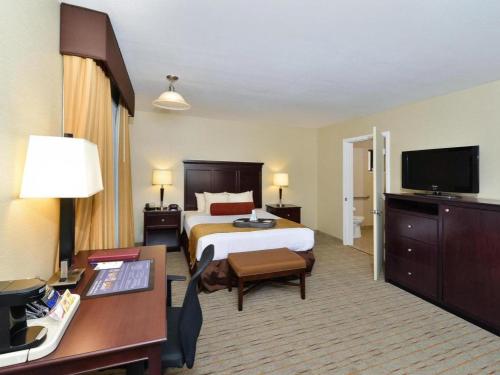 a hotel room with a bed and a desk at Best Western Frontier Motel in Lone Pine