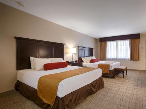 a hotel room with two beds in a room at Best Western Frontier Motel in Lone Pine