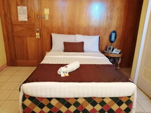 Ένα ή περισσότερα κρεβάτια σε δωμάτιο στο Hotel Asuncion