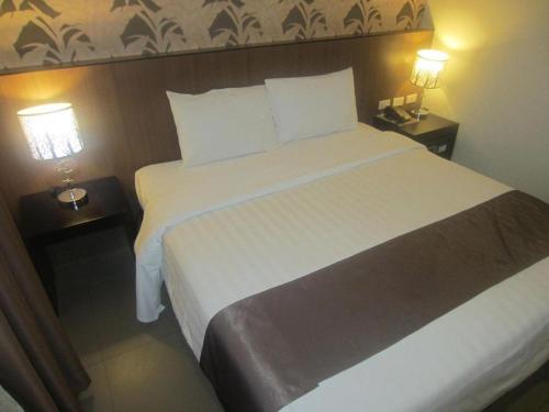 Кровать или кровати в номере GT Hotel Bacolod
