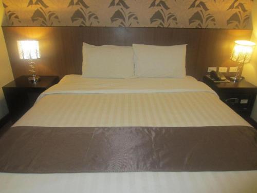 Кровать или кровати в номере GT Hotel Bacolod