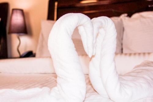Ένα ή περισσότερα κρεβάτια σε δωμάτιο στο Time Travellers Hotel