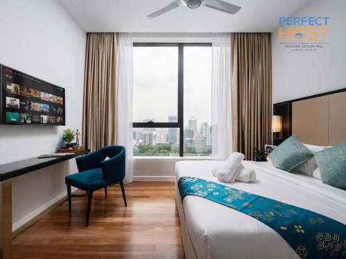 Ένα ή περισσότερα κρεβάτια σε δωμάτιο στο Pavilion Ceylon Hill Suites, KLCC