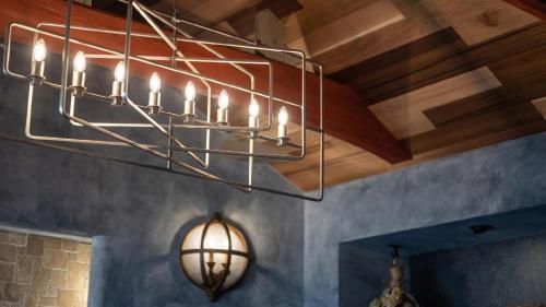 a chandelier hanging from the ceiling in a room at Yufuin Luxury Villa -zakuro- in Yufuin