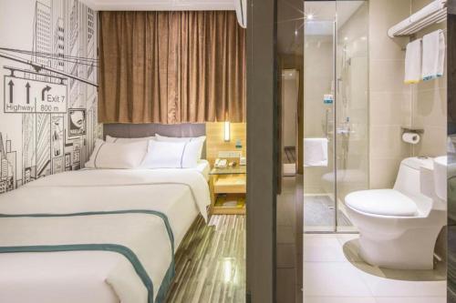 a hotel room with a bed and a toilet at City Comfort Inn Liuzhou The Mixc Xijiang Road in Liuzhou
