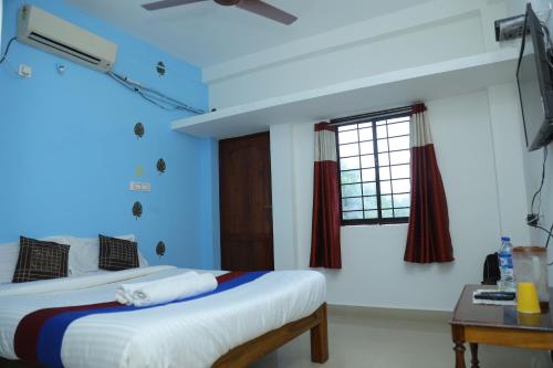 Katil atau katil-katil dalam bilik di La Belle Residency Near Auroville Beach