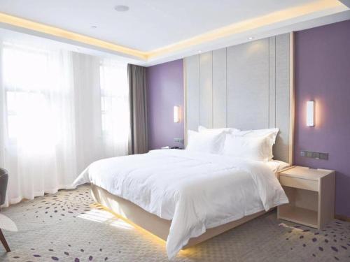 Letto o letti in una camera di Lavande Hotels Jinzhong Youjian Pingyao