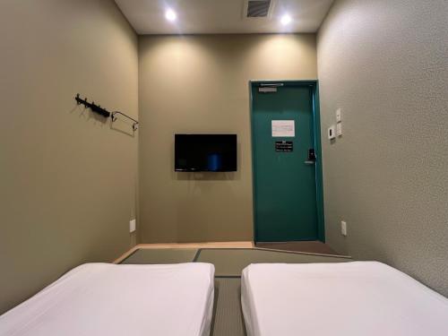 Hostel Hangoutにあるベッド