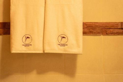 two towels on a towel rack in a bathroom at The Mansion Pakchong in Mu Si