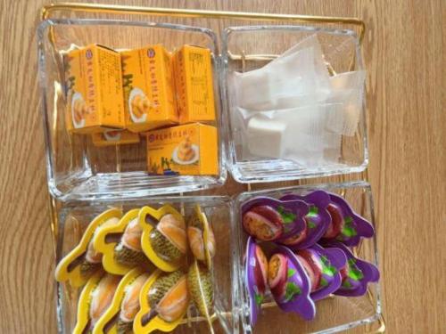 two plastic containers filled with different types of food at Vienna Hotel Guangxi Fangcheng in Fangcheng