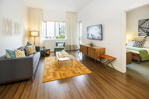 a living room with a couch and a bed at Verve Mountain View in Mountain View