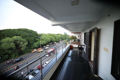 a view of a highway from the balcony of a building at Hotel Park Gardenia in Nagpur