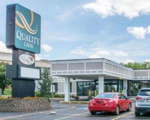 a car parked in front of a car dealership at Quality Inn in Geneseo