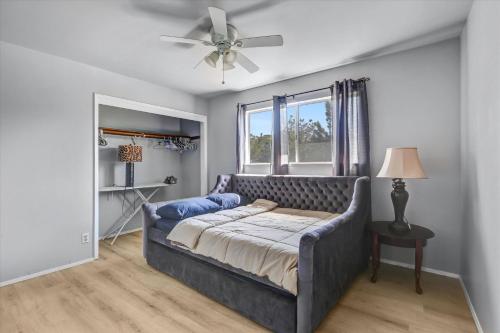 a bedroom with a bed and a ceiling fan at 16 Plus ADU Solana Beach DelMar Fair in Encinitas
