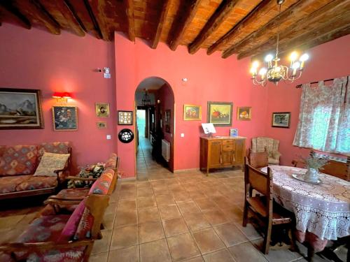 a living room with a couch and a table in it at Casa rural de la Abuela in Cadreita