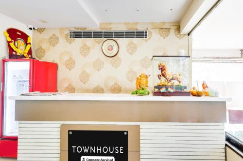 a view of a television in a kitchen with a counter at Super Townhouse Dwarka Nagar Near Ramatalkies in Visakhapatnam