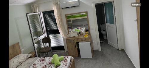 Kuchyň nebo kuchyňský kout v ubytování Hotel Anxhelo