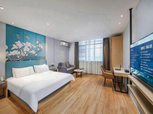 Ένα ή περισσότερα κρεβάτια σε δωμάτιο στο Jinjiang Inn Xuzhou Pizhou Sanchahe Road