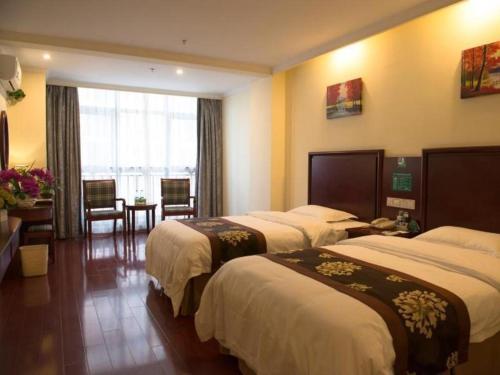 Ένα ή περισσότερα κρεβάτια σε δωμάτιο στο GreenTree Inn Anhui Hefei Tongda Road Wanhuan Shopping Plaza Business Hotel
