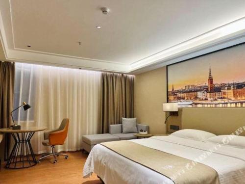 Ένα ή περισσότερα κρεβάτια σε δωμάτιο στο GreenTree Inn Qingyuan Qinghe Avenue Branch