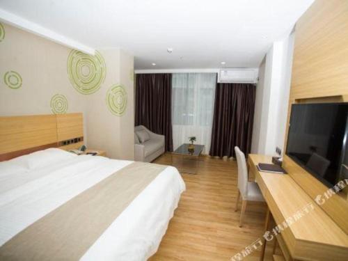Ένα ή περισσότερα κρεβάτια σε δωμάτιο στο GreenTree Inn Qingyuan Qinghe Avenue Branch