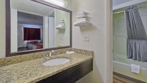 a bathroom with a sink and a mirror at Motel 6-Maple Shade Township, NJ - Philadelphia - Mt Laurel in Maple Shade