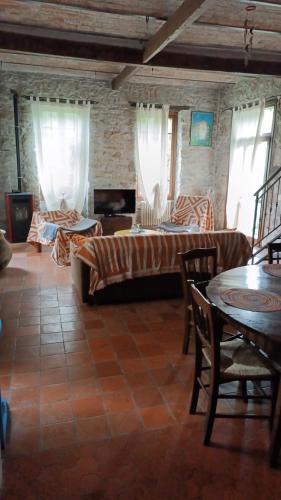 a living room with a couch and a table at La casa di Ele in Apricale
