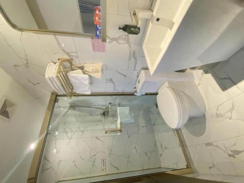 a bathroom with a toilet and a mirror at Beijing Inner Mongolia Hotel Chaoyang in Beijing