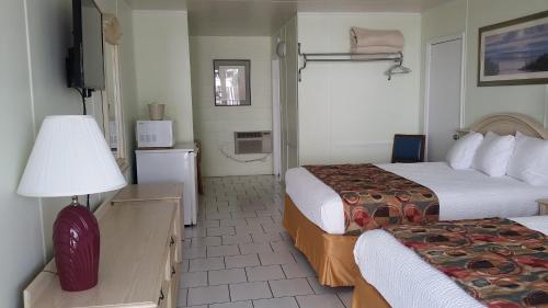 Letto o letti in una camera di Vancouver Motel