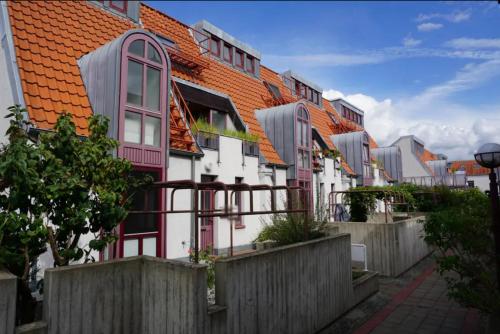 a row of houses with red roofs at Premium maisonette in city center with parking in Braunschweig