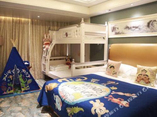 a bedroom with a pirate themed bed and bunk beds at Xian Jue Vu Hotel in Xi'an