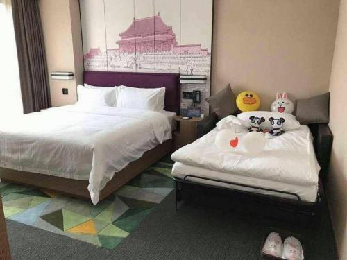 Postel nebo postele na pokoji v ubytování Hampton By Hilton ChangSha XingSha