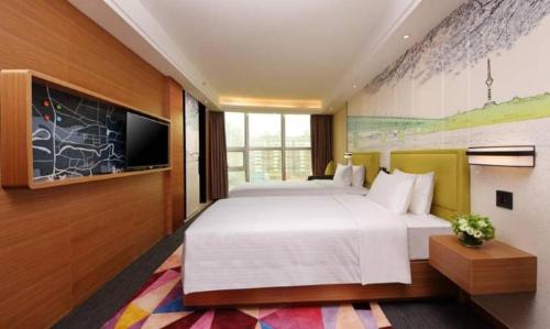 Postel nebo postele na pokoji v ubytování Hampton By Hilton ChangSha XingSha