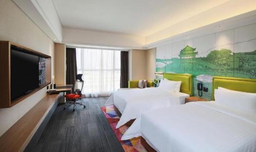TV a/nebo společenská místnost v ubytování Hampton By Hilton ChangSha XingSha