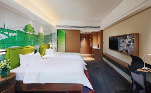 Postel nebo postele na pokoji v ubytování Hampton By Hilton ChangSha XingSha