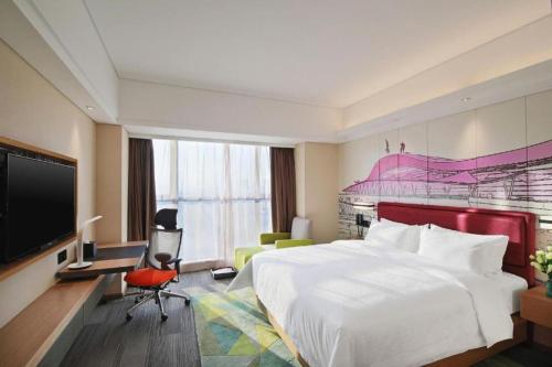 Postel nebo postele na pokoji v ubytování Hampton By Hilton ChangSha XingSha