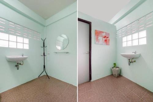 a bathroom with a sink and a mirror at OYO 75322 Tha Burapa Resort Bangsean in Ban Laem Thaen