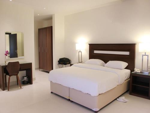 Ένα ή περισσότερα κρεβάτια σε δωμάτιο στο Unique Suites