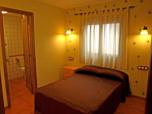 Ένα ή περισσότερα κρεβάτια σε δωμάτιο στο Can Joan