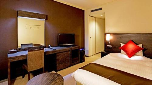 Un ou plusieurs lits dans un hébergement de l'établissement Century Royal Hotel Sapporo