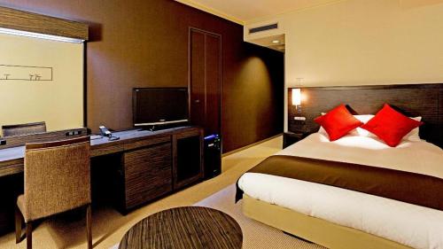 Un ou plusieurs lits dans un hébergement de l'établissement Century Royal Hotel Sapporo