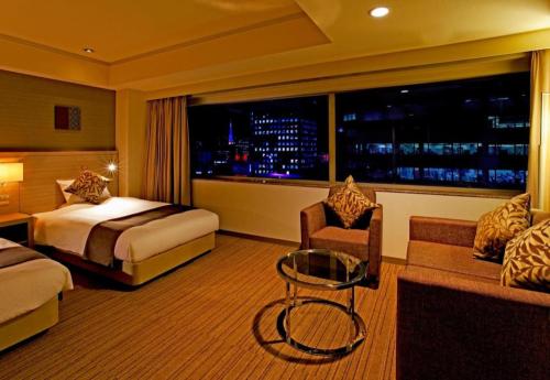 Un ou plusieurs lits dans un hébergement de l'établissement Century Royal Hotel Sapporo