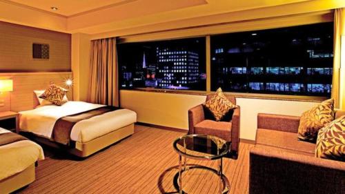 Un ou plusieurs lits dans un hébergement de l'établissement Century Royal Hotel Sapporo