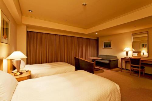 Un ou plusieurs lits dans un hébergement de l'établissement Century Royal Hotel Sapporo