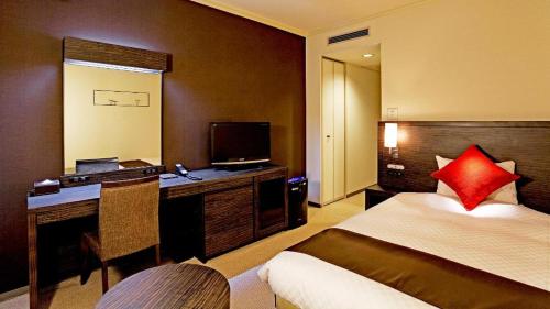 Un ou plusieurs lits dans un hébergement de l'établissement Century Royal Hotel Sapporo